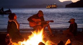There are at least four types of waves in this picture—only the water waves are evident. There are also sound waves, light waves, and waves on the guitar strings.